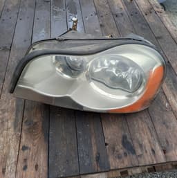 VOLVO 89910427 Headlight left VOLVO XC90 I (2002-2014) — thumbnail 1