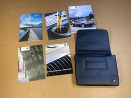 BMW Original BMW X5 E70 CCC ESPANOL OWNER MANUAL HANDBOOK WITH CASE WALLET — thumbnail 1