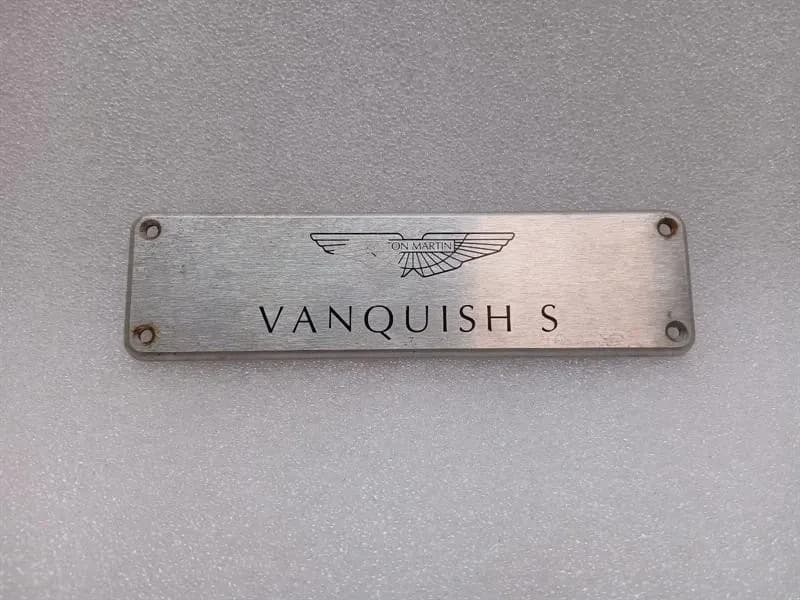 ASTON MARTIN ASTON MARTIN VANQUISH S 04-07 V12 COVER VANQUISH S DOOR POST LOGO PLATE